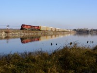 A westbound train of autoracks crosses the Mountsberg Reservoir on a beautiful late autumn morning with what seems to be CPs standard power issue these days.