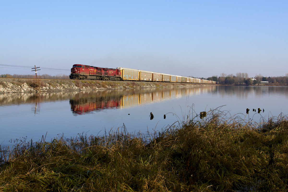 A westbound train of autoracks crosses the Mountsberg Reservoir on a beautiful late autumn morning with what seems to be CPs standard power issue these days.