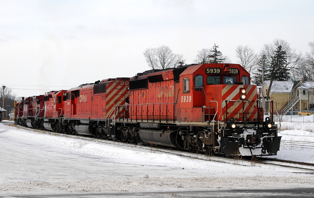 440 departs Galt with CP 5939, CP 9014, CP 5867, CP 9675, CP 8223 and CP 3057 after lifting 5 autoracks from the CN Fergus Sub