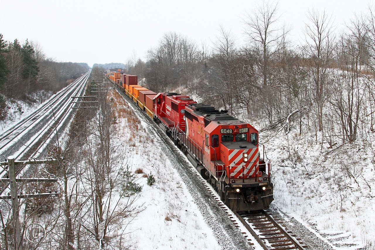 CP 6048 and trailing CP 6255 lead train 248 at the Denfield Road bridge. Later in the day, Dave Brook would catch the same train at Puslinch with the addition of trailing units CP 9606 and 8737.