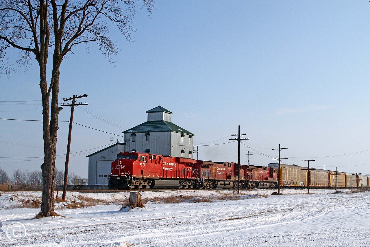 CP 9374-241, with CP 9827 and 8538, roll past the grain elevator turned office tower at Elmstead mile 101 on the CP's Windsor Sub.