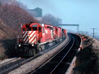 It has already been a week since the infamous Mississauga Wreck, a disaster of epic proportions as far as the CP was concerned; and this view shows a westbound CP 5530, 4727 and C&O 3561 detouring over the CN Dundas sub approximately mile 4.2. Not the safest place to be shooting from, but, being caught walking along the outside of the RoW there wasn't much of an alternative. Certainly something one would never try today. In the distant background Sydenham Rd bridge can be seen, as well as the old Canada Crushed Stone screen-house and the remains of the overhead conveyer.