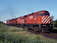 Four MLW's power train 903 through Cherrywood on a perfect July afternoon.