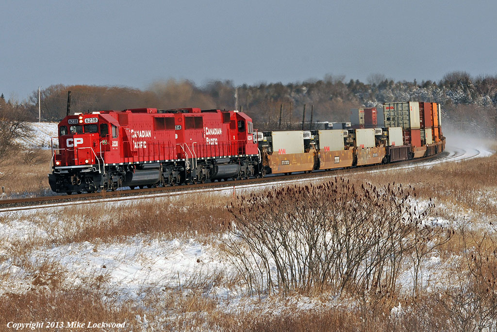A refreshing change from the horde of toasters and waffle irons heading up most CP freights, two shopped SD60's, CP 6238 and 6234, roll what I think was 143 through Lovekin. 1434hrs.