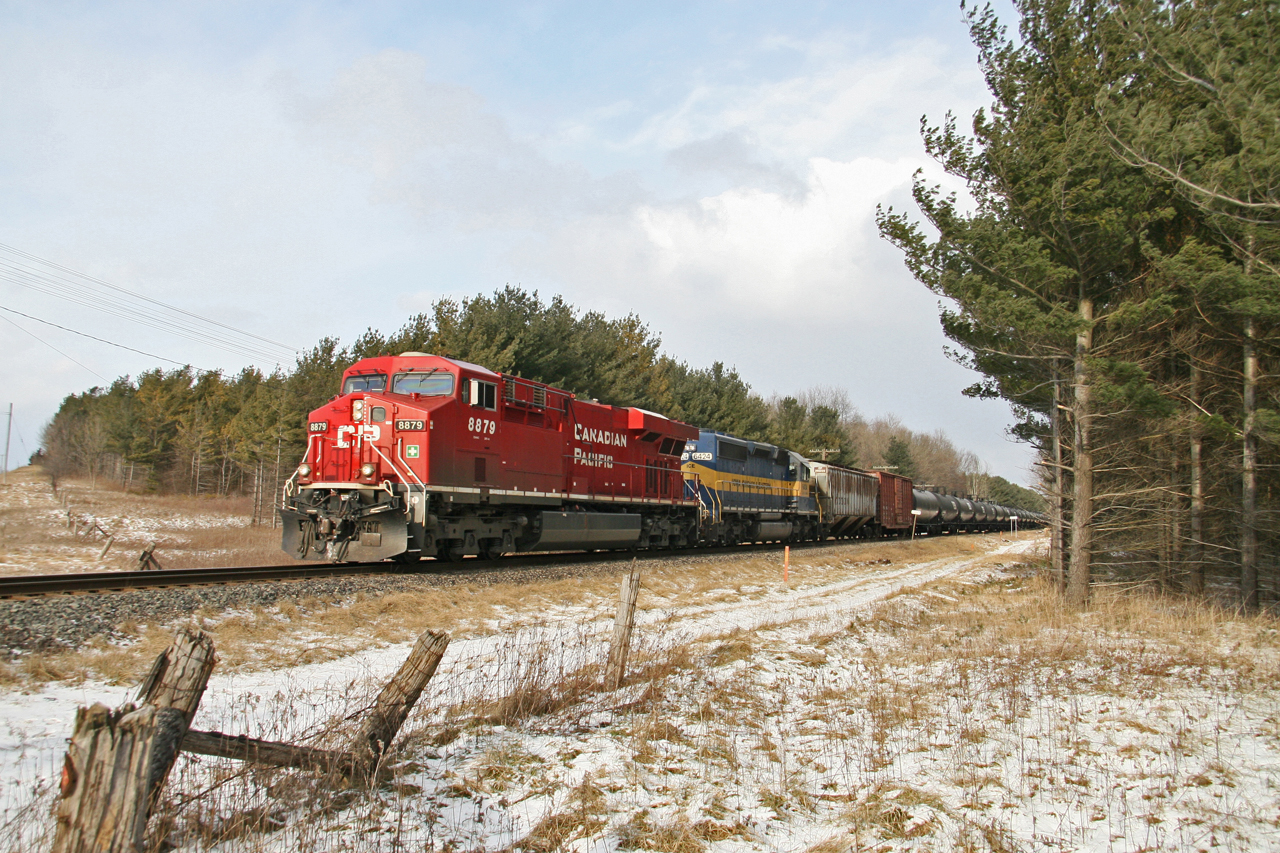 CP 8879 leads train 255 over the HBD one mile west of Pender on the Galt Sub.   Photo is from Oxford Rd 4 just NE of Woodstock, ON.