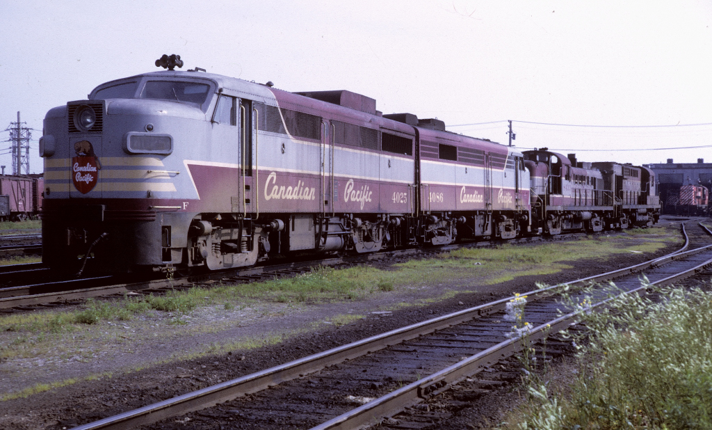 A power set consisting of FA-1 4025 FA-2 4086 and an RS-3 and RS-10 await a call in St Luc Yard.