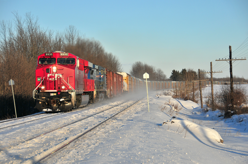 CP 233 is passing the small town of Winchester, on the Winchester Sub. in the last rays of the sun.