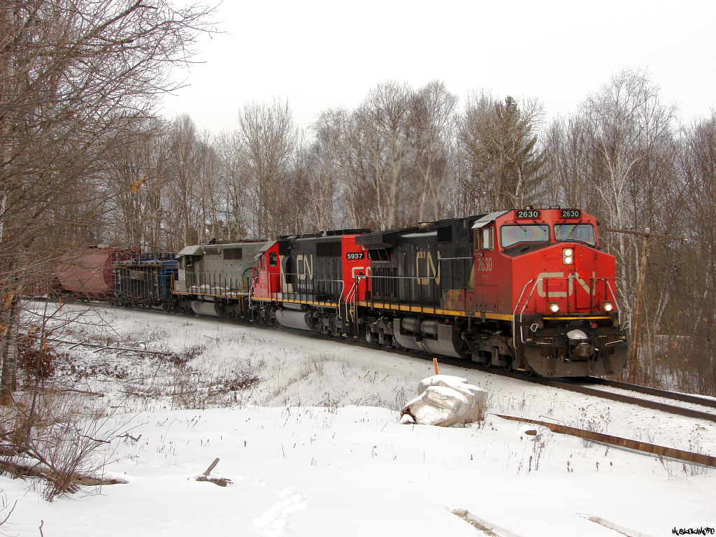 CN X31641 27 - CN 2630 South on the approach to Falding with a train consisting of auto traffic from Symington and some overflow Capreol traffic from Sudbury, plus a repaired B/O car they lifted from the yard at South Parry just up the road.