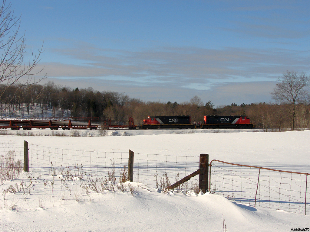 CN O48331 04 - CN 5291 North on the approach to Waubamik, running ACOT up CN's Bala sub contrary to a Directional Running Agreement with CP due to issues with their train against a dimensional move on their side, providing the rare opportunity to shoot some SD40's running North of Parry Sound on the CN, just like old days!