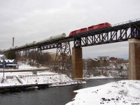 CP 6240 South with train DIM-006 consisting on 35 W10 dimensional load's in the form of windmill tower parts loaded onto 50 TTYX flats, flying over the town in Parry Sound late in the evening light. When they happen, these W10 dimensional moves aren't authorized to run across CN's Bala sub per DRZ agreement, providing a rare opportunity to grab a Southbound running down CP's Parry Sound sub, just like old days! 