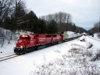 CP 6240 South with train DIM-006 very slowly pull through Rosseau Road on the approach to Brignall, these W10 dimensional loads had a stop, examine, and proceed at 3 MPH restriction through the rock-cuts pictured in the background. Pictured here at 16:42, the pressure was on with 12 miles to go before getting into MacTier to tie down in track 2 for the night, as these loads are restricted to daylight movement only unless special authorization. 