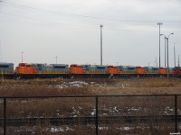 [Editors note: Accepted due to 'HOT' news item] QNSL 521, 515, 517, 516 and 514 all sit outside the shop area in MacMillan yard waiting for the shop switcher to start moving them up to the other side of the facility, waiting for their assignment Eastwards towards Montreal. 