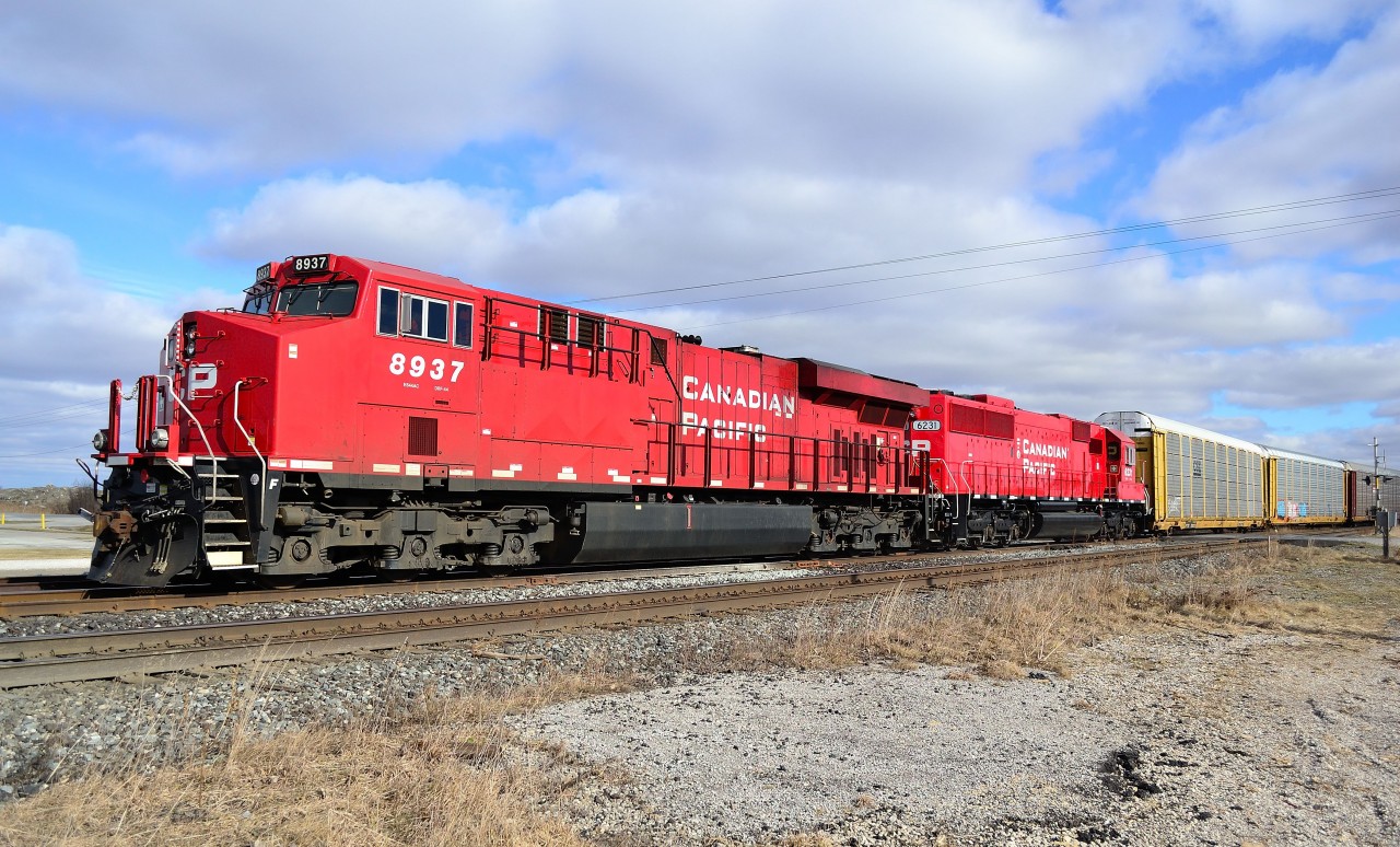 CP 235 led by 8937 & 6231, goes in the siding at Tilbury to clear for an oncoming eastbound. This is 6231's maiden voyage after just being rebuilt, repainted and released from CAD in Montreal. 6231 used to be SOO 6031