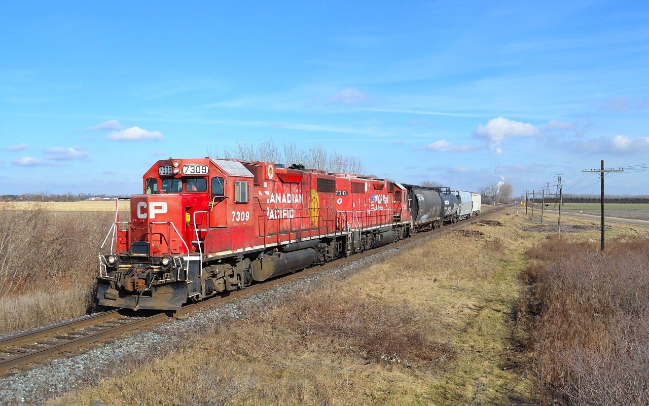 Led by a pair of ex D&H GP38-2's, CP T76 heads westbound past where once was the location of Ringold Station.