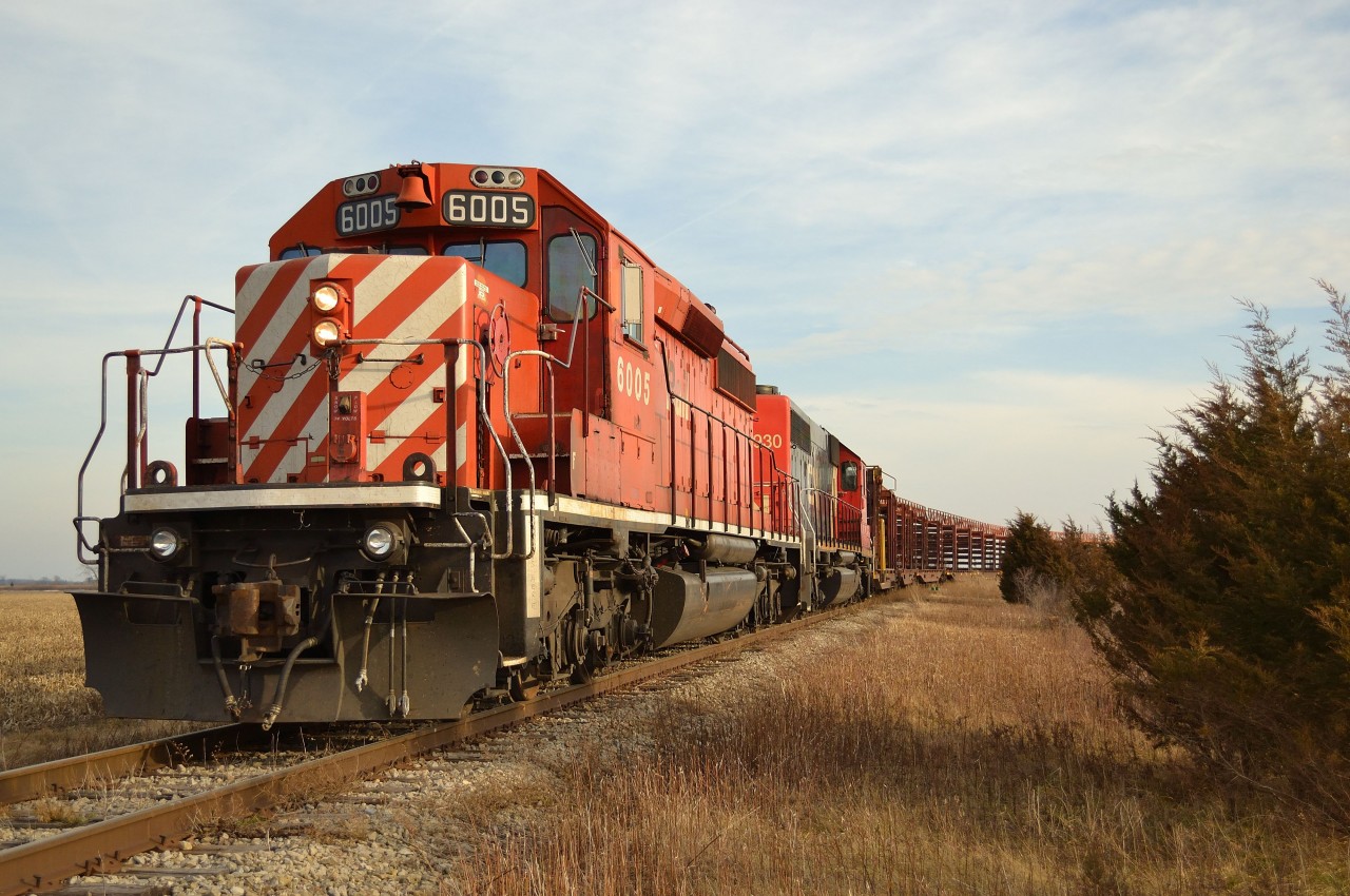 The current CASO work train consisting of CP 6005 & GTW 5930 proceeds to back around the bend at Fargo and onto the CN CASO Sub so they can resume rail removal operations once again.