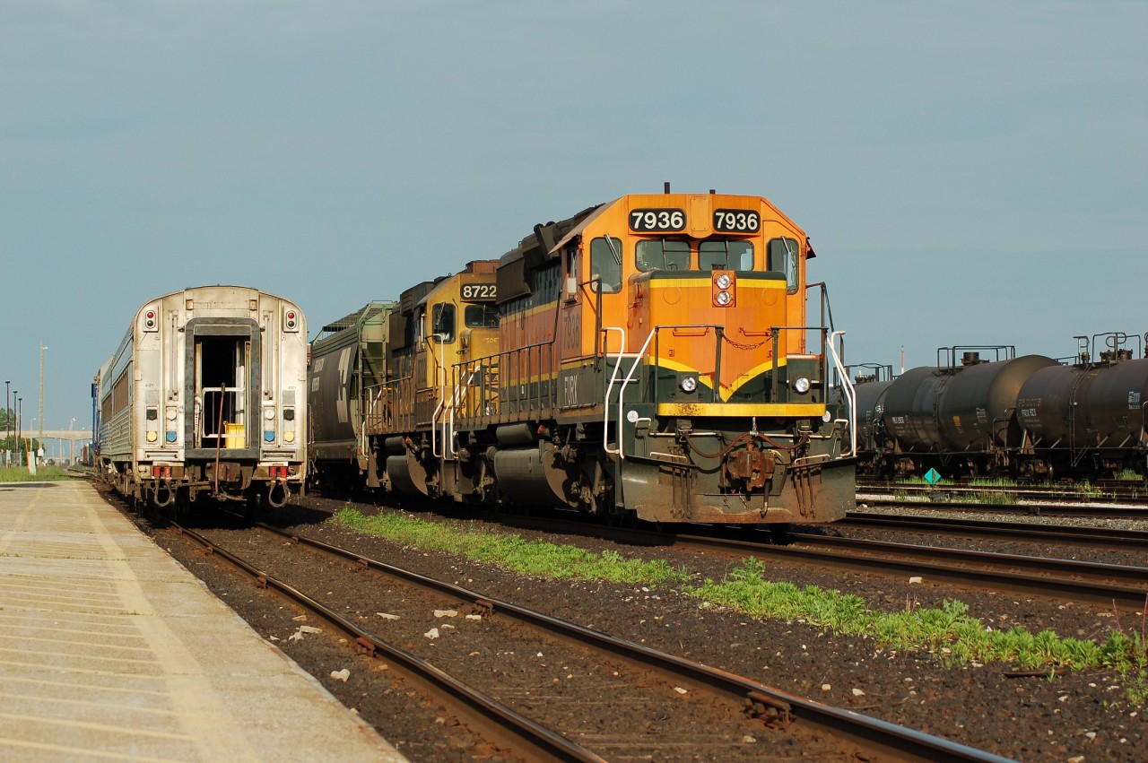 Annother fine summers eve has FURX SD40-2 7936 and BNSF GP60 8722 in charge of westbound CN train #395 passing by VIA #88 waiting to depart for Toronto. The evening VIA train out of Sarnia has sinse been cancelled and the BNSF power flocking CN has all but dissapeared.