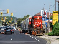 I think the crew on 580 was having fun plowing over the construction barrels that a paving contractor moved off the road and placed a little too close to the railway track. It was only when the barrels started to roll out in to the traffic lanes on Clarence Street that the crew got on the ground to collect the rolling barrels and move those that remained standing out of the way.