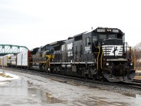 NS 1068, the Erie heritage unit, became the 2nd NS heritage unit to find its way in to Canada today on NS H3R from Buffalo. NS 8300, a former CR C40-8, made for a good companion on today's train, seen here lifting their first cut of US bound traffic out of the yard in Fort Erie. Murph's Law, it came over from the US leading long hood forward and in the pouring rain.