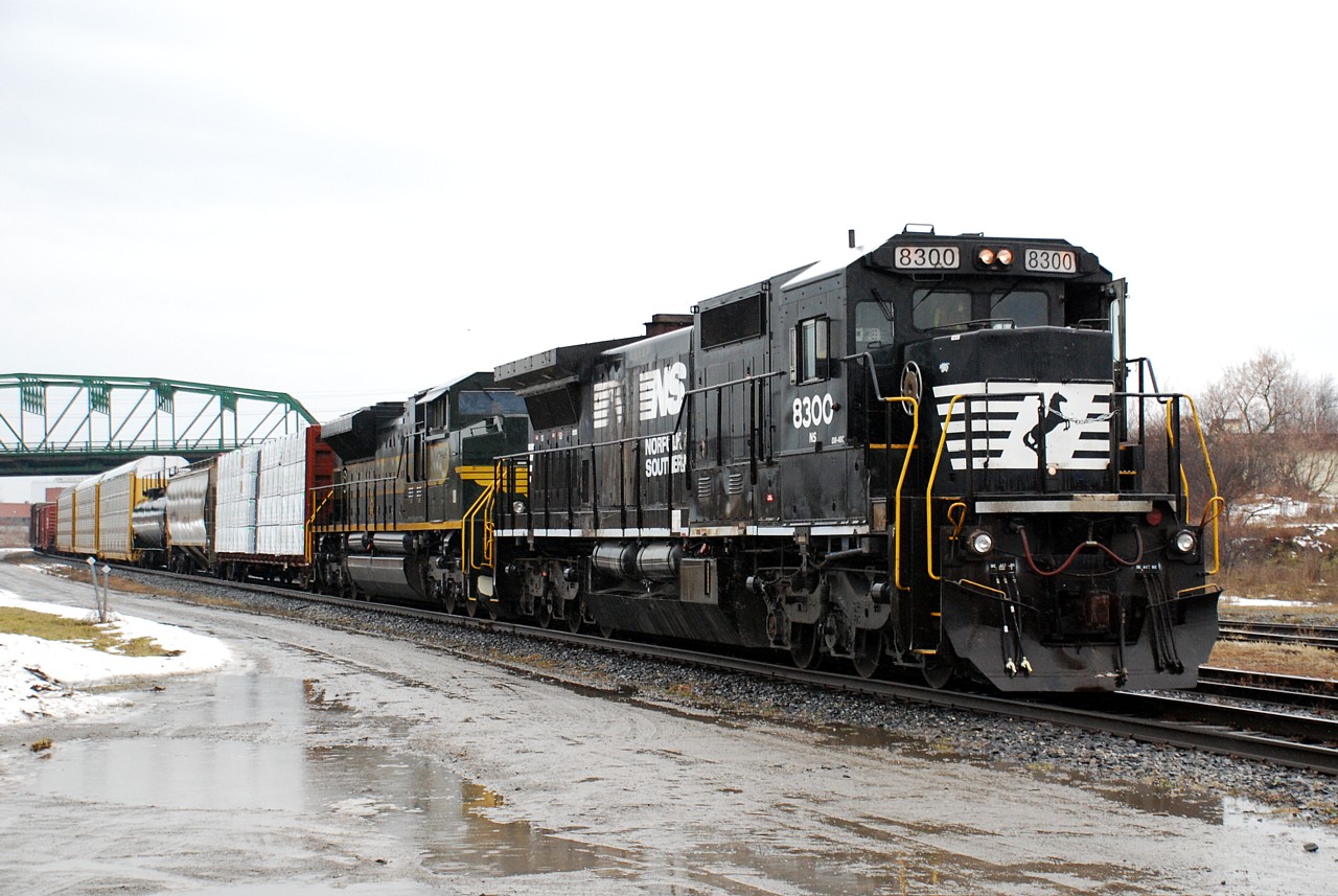 NS 1068, the Erie heritage unit, became the 2nd NS heritage unit to find its way in to Canada today on NS H3R from Buffalo. NS 8300, a former CR C40-8, made for a good companion on today's train, seen here lifting their first cut of US bound traffic out of the yard in Fort Erie. Murphy's Law, it came over from the US leading long hood forward and in the pooring rain.