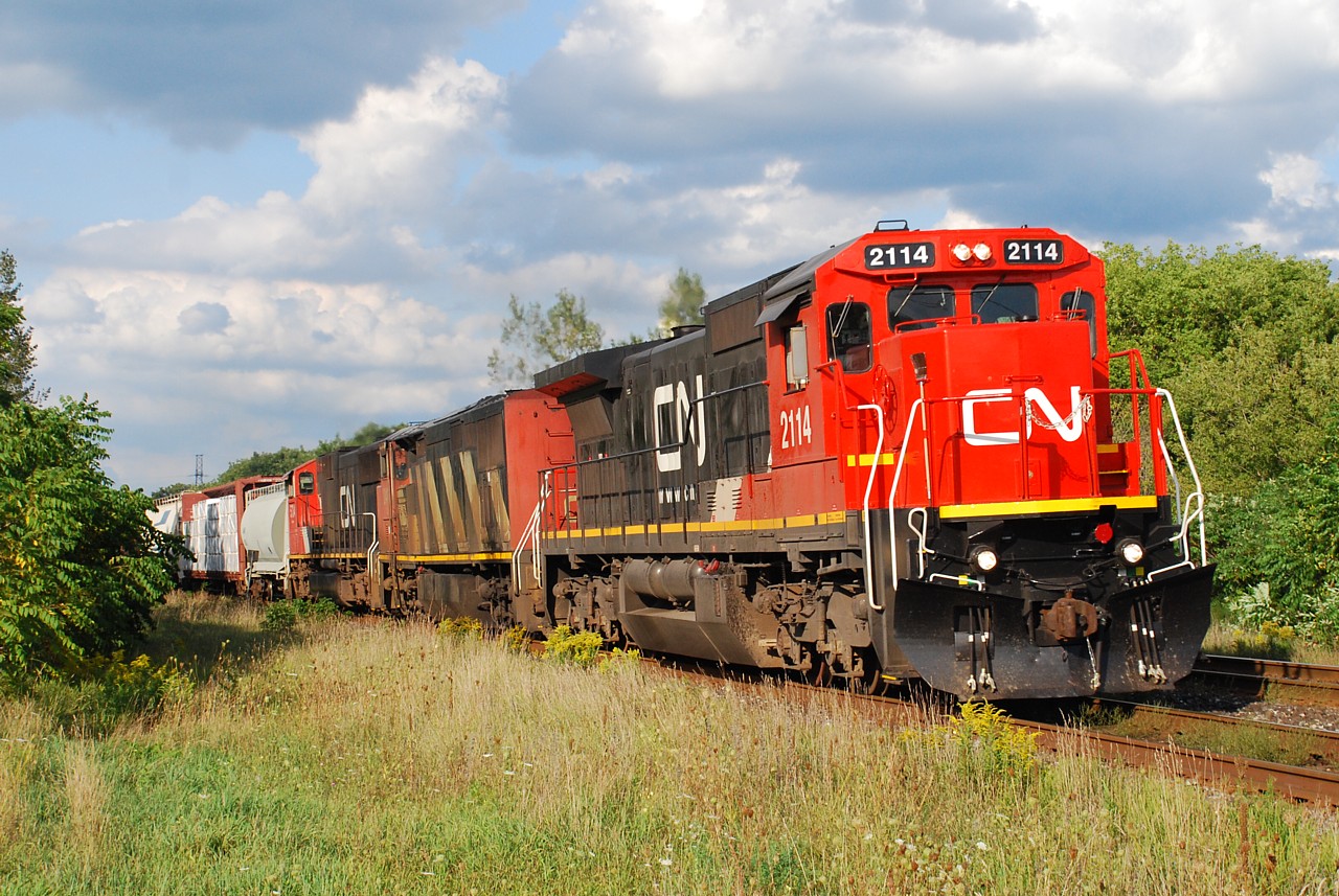 A late running 331 permitted a chase after work. A well timed break in the clouds that lasted only a minute or so helped light the scene as the train blew through Ingersol a few minutes before 6:00 pm.