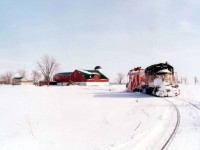 After making sure the line was clear from Clinton Jct down to the end of steel at Centralia, GEXR 179 and plow x-CN 55437 start the run back north. They picked up one empty bulkhead at Centralia to take back with them.