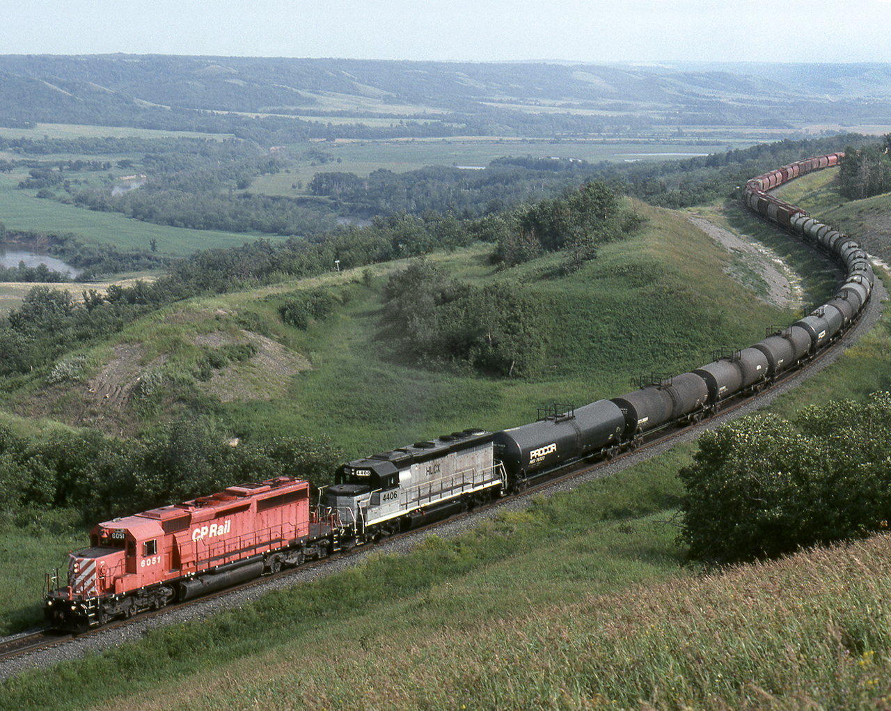 Westbound mixed freight on CP's north main across the prairies climbs the grade out the Assiniboia valley near the Saskatchewan boundary. The Bredenbury subdivision has been called Manitoba's mountain railway with 3 valley crossings all with 1 pc plus grades including a 2 pc climb out of Minnedosa.