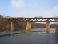 Via 72 with Via 903 on the point crosses the Grand River Bridge at Paris Ontario amid a snow flurry.  