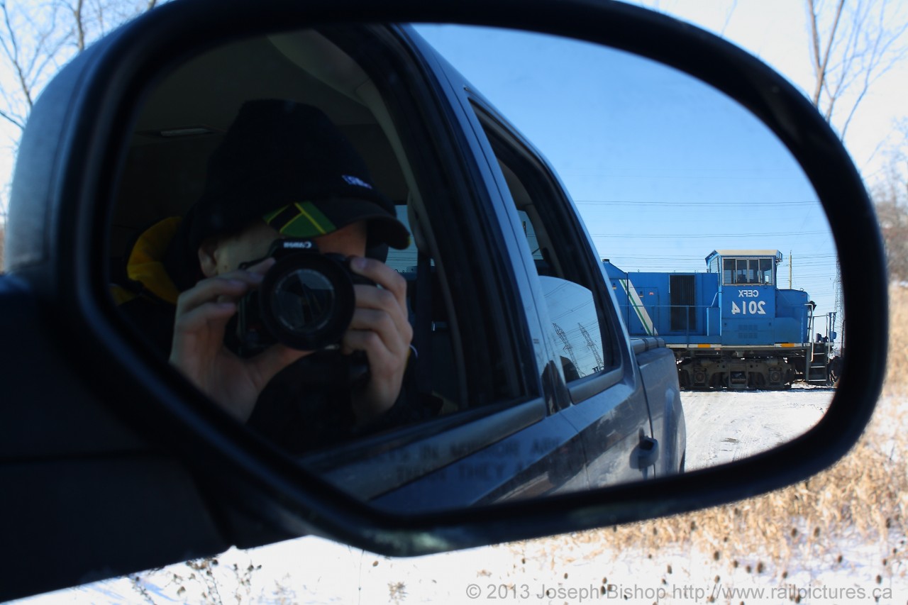 While driving away from Garnet I tried a different shot.  SOR 597 was making their way across the level crossing and CEFX 2014's cab was nicely framed in my rear view mirror on the truck.
