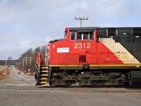 CN M30511-19 flys over Pentcoastal Road near Cobourg Ontario during a windy and cold afternoon.
