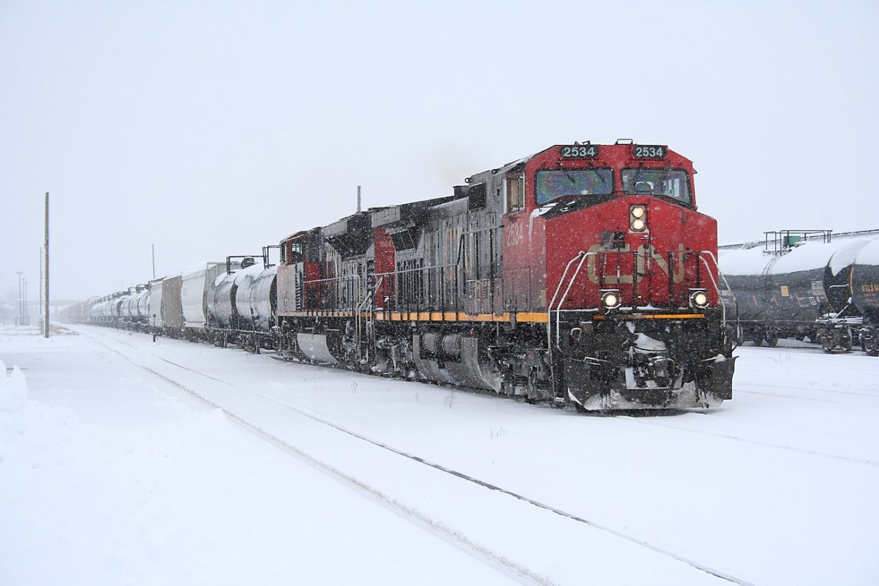 Railroading is an all weather operation, and while the OPP might be a bit busier this afternoon responding to highway incidents, a little bit of snow doesn't even faze the crew of CN 393 as they clear the customs scanners and depart Sarnia for Port Huron, MI.
