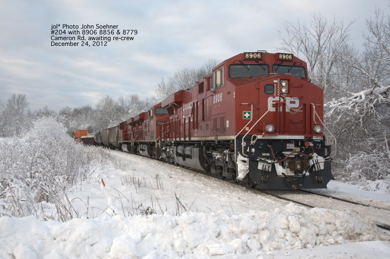 CP train #205, leader 8909, stopped west of Cameron Rd., awaits a re-crew December 24, 2012