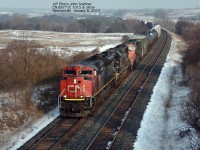 CN manifest freight with CN 8877 IC 1056 & CN 5656 at Newtonville Road January 8, 2013.  