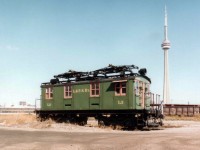 An old London & Port Stanley electric motor #L2 sat for many years on a lonely spur down near the Toronto waterfront. I cannot remember exactly where, as the spur I believe has been removed for quite some time. The motor was purchased by a private individual and moved in 1993 to Brampton. It was subsequently relocated to the Halton County Radial Museum at Rockwood, ON in 1997 and remains there as part of their collection.  In the view looking North toward the CN Tower one might ask "Where is the City"??  Well, it IS back there........somewhere.