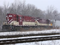 After servicing the CP interchange in Woodstock the GP7 and GP9 head across the diamond at Carew in a heavy snowfall almost a year from the day this photo was posted. 