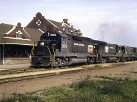 Eastbound out of the Detroit River Tunnel, Penn Central 3173 and trailing units 2925 and 2541 charge past the station in Windsor with Chicago to New York City train NY4.