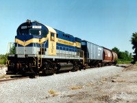 The new Port Colborne Harbour Railroad had just started up when this image was taken. With former strawberry farmer Wayne Ettinger as Prez/Mgr, and New York & Lake Erie operator Robert Dingman as Chairman/Treasurer, the new railroad officially began June 25th 1997 after ceremonies the day before. This NYLE C425, one of Dingman's, came over to Canada via CN's 332 on the 22nd and was stenciled (at least part of it) the next day. The round decal to adorn the cab was not yet applied. Photo was taken as train sat on the new section of track which ran from the old CN Dunnville Sub line in town, up along the west side of the canal to connect with the yard just north of of the community. This new line was necessated by the removal of old bridge 20 which had connected the CN Humberstone, the east side trackage with the west.