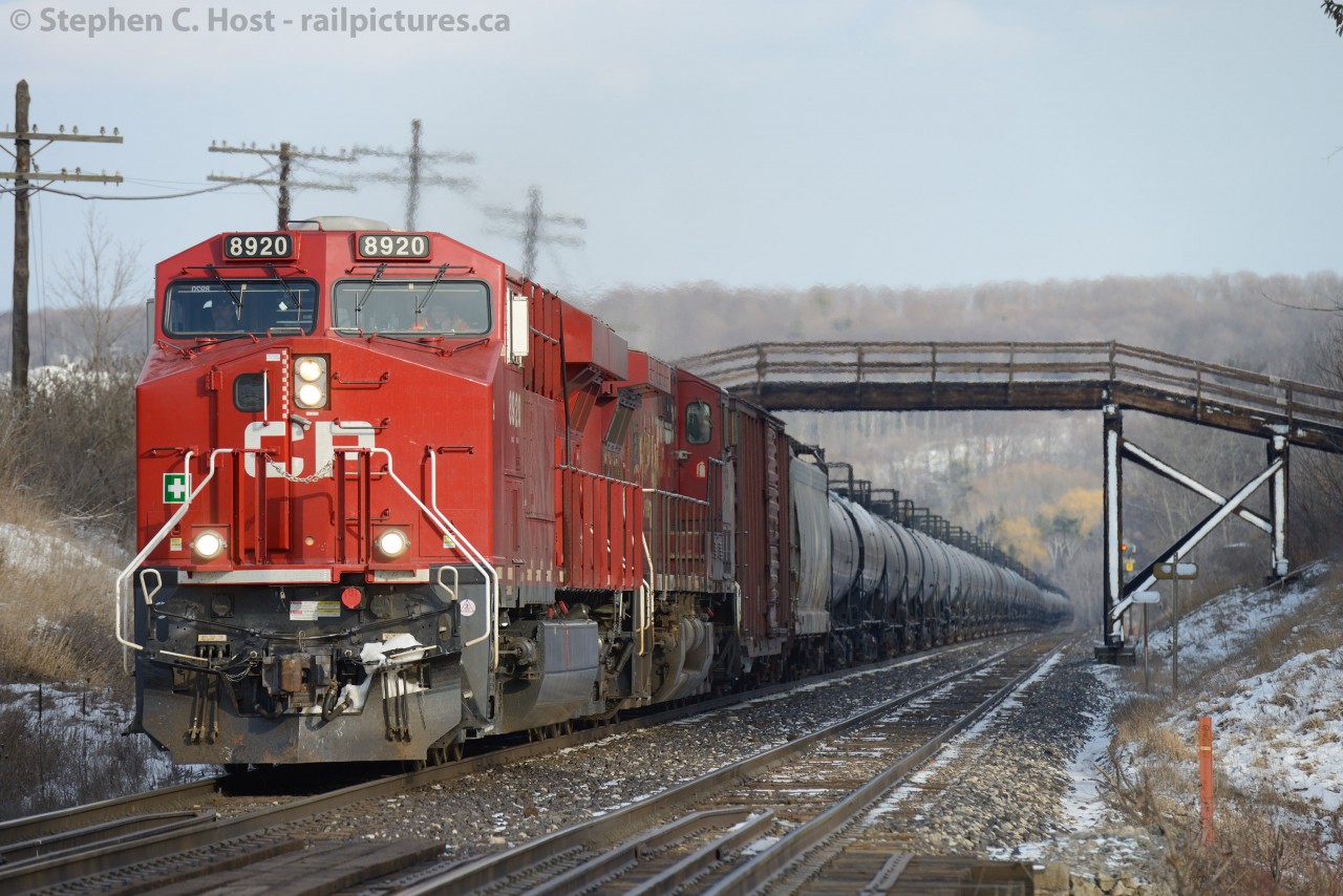 CP train 609-408 is cruising up Campbellville hill under a farm bridge but has just been instructed by train 234 they are to meet them a few hundred feet ahead and perform a rollby. 234 blew a hosebag 3000' back and had a hell of a time replacing it, 609 was earlier asked by the RTC to assist. 609 being a train of empties had little trouble slowing to a stop in time to meet the head end of 234 and help them get on their way.