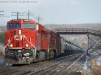 CP train 609-408 is cruising up Campbellville hill under a farm bridge but has just been instructed by train 234 they are to meet them a few hundred feet ahead and perform a rollby. 234 blew a hosebag 3000' back and had a hell of a time replacing it, 609 was earlier asked by the RTC to assist. 609 being a train of empties had little trouble slowing to a stop in time to meet the head end of 234 and help them get on their way.