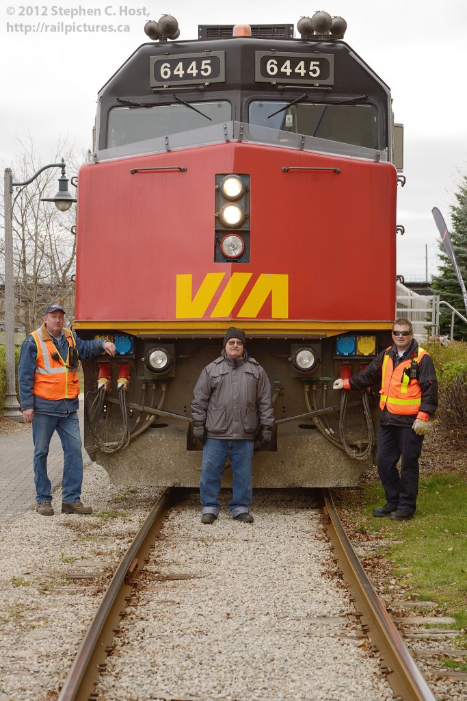 Railway Men - Pictured are some of the people who were responsible for bringing the Grey Cup Train to Guelph, Ontario. From left to right - Brad Jolliffe, Ontario Southland Railway (Pilot), Tom Sagaskie, General Manager, Guelph Junction Railway, and Jordan Mcallum (VIA Rail Engineer). Tom Sagaskie put in countless hours in negotating with partner railways for a contract to make this happen - The Canadian Football League, VIA Rail, Goderich-Exeter, CN (!), and even Metrolinx who all had a hand in delivering this train in Ontario. (Canadian Pacific was involved out west, only).  Sources indicate in the first hour a few hundred people went through the display cars, thusly Thousands of people managed to tour it in its few hour display in downtown Guelph. Of course, three weeks later it was announced the Hamilton Tiger-Cats football team would play in Guelph - as their stadium is under construction in 2013 and the University of Guelph Alumni Stadium will serve as home field for 2013.