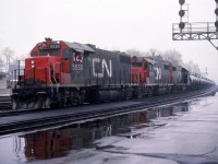 CN 715 is passing the east end of the Brantford Yard with a loaded sulfuric acid unit train @ 11:14 with CN 5530 - CN 5529 - CN 5516 and 36 tank cars with CN van 79278 on the tail end.