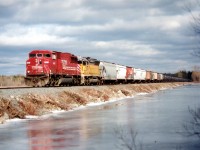 Nice sunny but cool day at the Mountsberg Reservoir to witness ethanol empties heading westbound over the causeway. SOO 6061 and CEFX 2786 for power made this train a bonus. Note general freight tacked on the head end at Welland, which was a frequent happening.  Anything to save money!! :o)