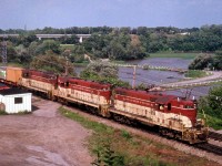 A relatively early afternoon "Starlite" thru Bayview Junction results in an all-TH&B photo free of shadow. Power is TH&B 71, 73 and 75, a matched trio of GP7 locomotives.  The #71 demo'd in a 1980 wreck, the #73 is now CP 1683 and #75 CP 1685; both based at Winnipeg and set up for remote control service.