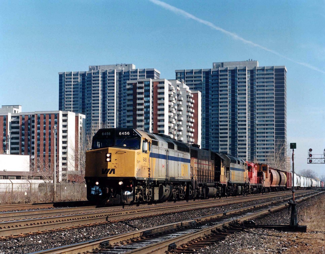 Back in those delightful days (for the fans) of no-end CP leasing, we see the Guelph Jct. turn westbound for the Jct with VIA 6456, HATX 216, VIA 6455 and CP 8241 passing thru Etobicoke on a crisp, clear March 12, 1995. This train wyed their power at Guelph Jct. before heading back east.  Yes, it was power worth following.