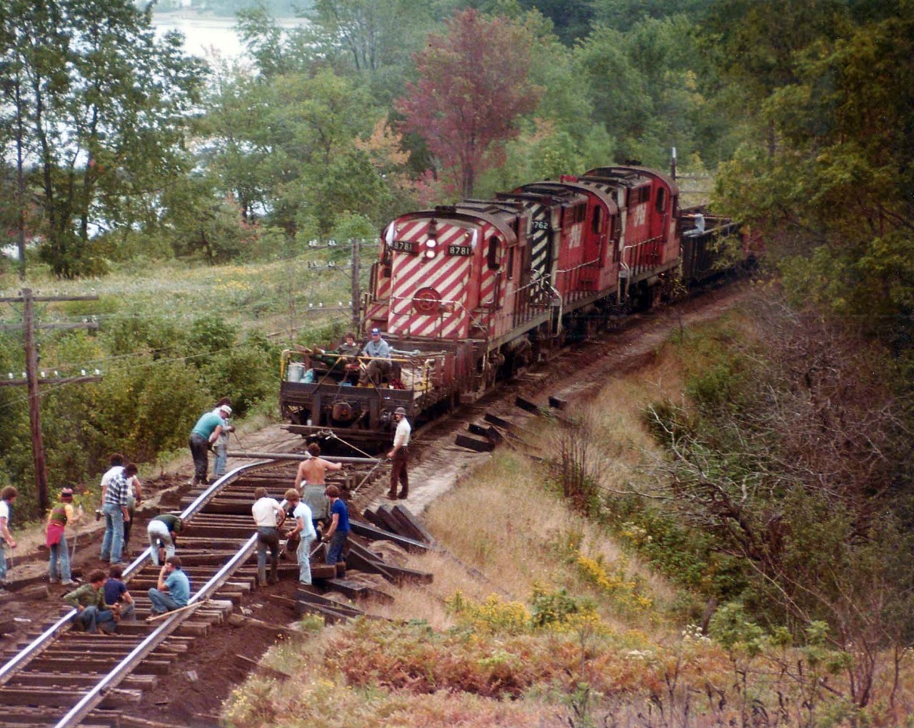 CP work extra with RS-18 8781, 8762 and another 87xx are seen here working near Westfield Beach, about 10 miles out of Saint John. All manual labour involved in contrast to todays all-purpose machinery. And a bit laid-back as well. With todays standards as a guide, can you spot any safety infractions????  :o)