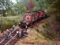 CP work extra with RS-18 8781, 8762 and another 87xx are seen here working near Westfield Beach, about 10 miles out of Saint John. All manual labour involved in contrast to todays all-purpose machinery. And a bit laid-back as well. With todays standards as a guide, can you spot any safety infractions????  :o)