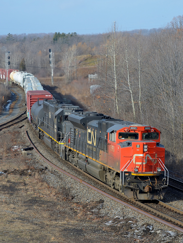 CN 148 glides through Hamilton West with 8893 and IC 1036 on a warm January morning.