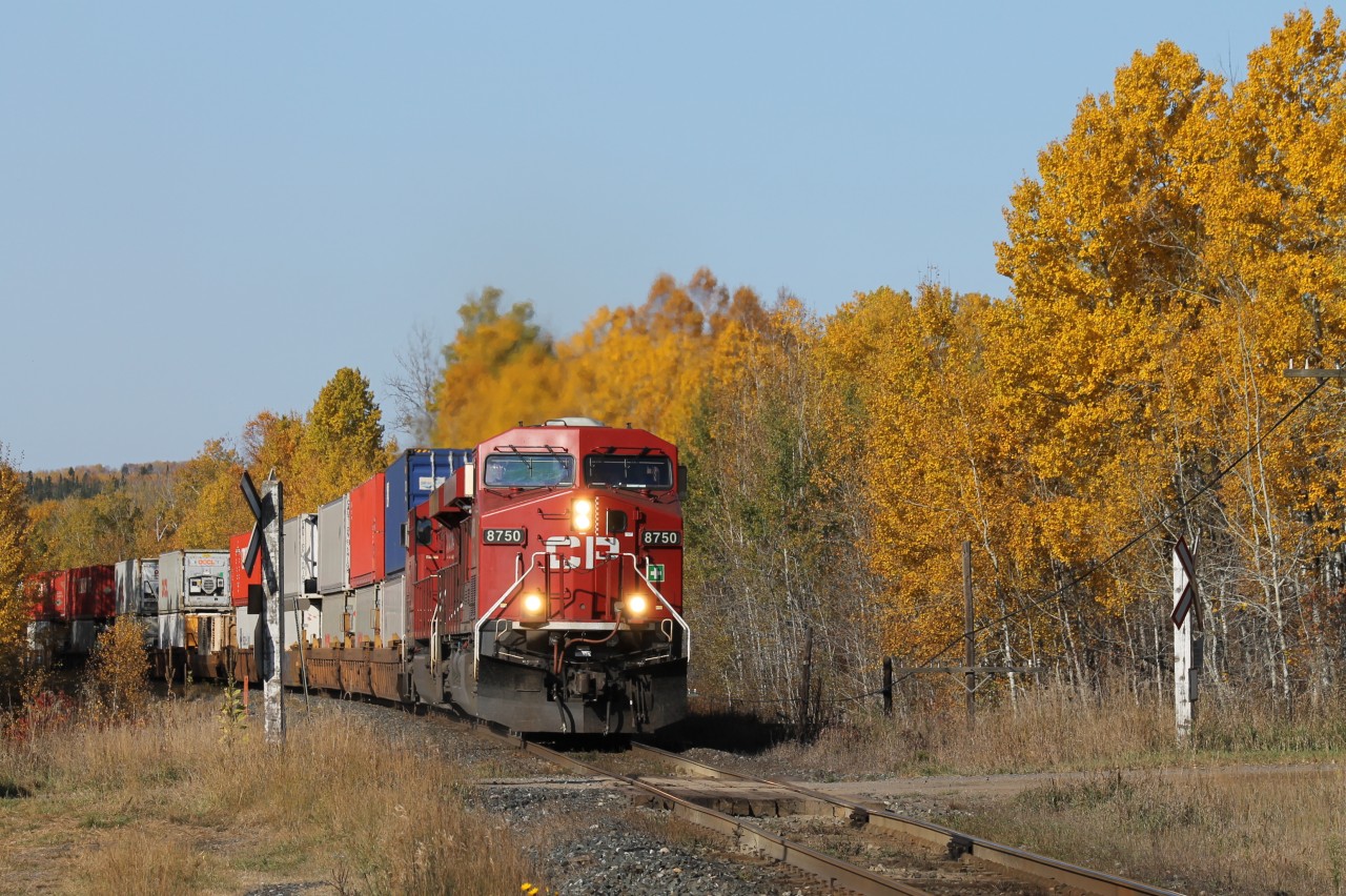 Canadian Pacific train #202 led by  CP 8750 and CP 8832 eastward bound amid the fall colours of northwestern Ontario.