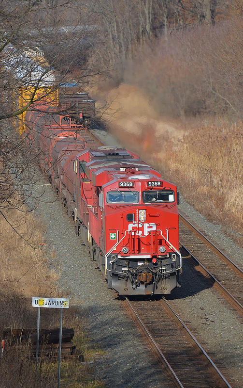 Sudbury ON to Buffalo NY train 246 eases through Desjardins on the Hamilton Sub. The train is finally moving again after losing it's air at MP 62 near Waterdown ON. It took the conductor quite some time to locate the defective air hose and repair it so they could continue their decent down the Niagara Escarpment. The train will set off the head end coil cars at the Steelcare facility at Aberdeen Yard shortly and proceed to Buffalo.