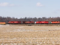 CP6048, SD60 6255, AC44 9606 and AC44 8737 race east with solid boxes to meet Steve Host's oil train. Nice to see an SD40 still leading a hot train.