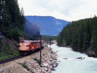 CP Rail train 2, the Canadian, approaching Field BC station, running along the Kicking Horse River.